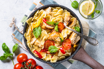 Pasta with chicken and vegetables top view.