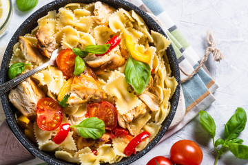 Pasta with chicken and vegetables top view.