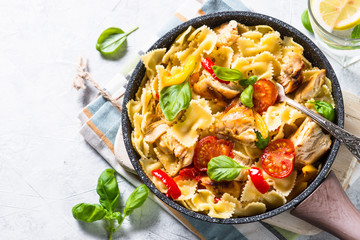 Pasta with chicken and vegetables top view.
