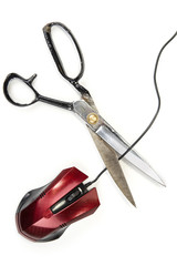 Computer mouse with black cable  and scissors. Cut out or wireless connection
