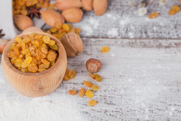 Ingredients for cooking bread or cookies: honeycomb, flour, raisines, mix of nuts, spices