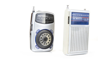 Fototapeta premium Old and small transistor radio on battery on the white