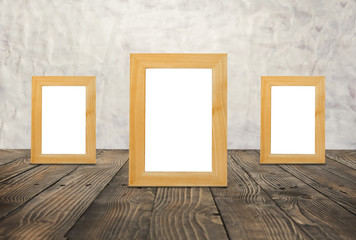 Blank wooden frames on the brown wood floor