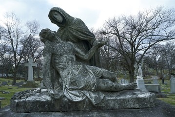 old carved stone figure on grave women gravestone in graveyard, memorial angel on tombstone