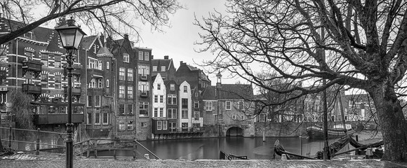 Cityscape, black-and-white panorama - view of the city Rotterdam and its old district Delfshaven, South Holland, The Netherlands