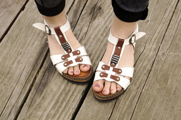 Female sandals on a wooden background
