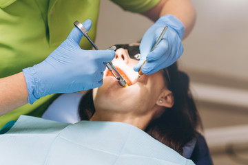 The dentist does anesthetic injection. Local anesthesia.