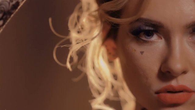 Beautiful woman touches her face with hand