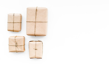 Obraz premium Parcel. Wrapped boxes ready to delivering on white background top view copy space