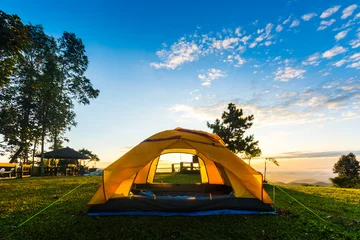 Foto auf Alu-Dibond Orange tent glows under night sky. © Loveischiangrai