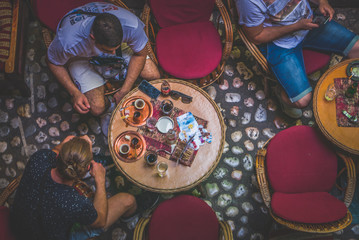 Coffee culture on the streets of old town. People of all generations meet to chatter.