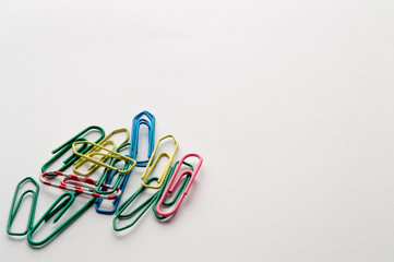 Paper clips in a colors, isolated on white background