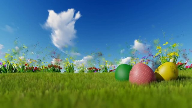 Easter eggs on green meadow with particles flying against blue sky