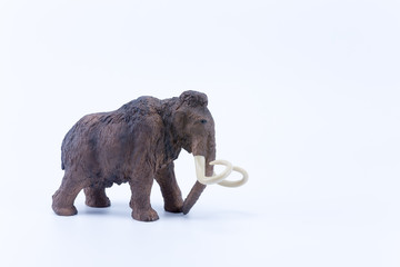 Profile of a Mammoth toy on white background