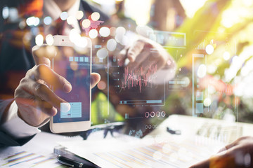 businessman hand working with modern technology and digital layer effect as business strategy concept