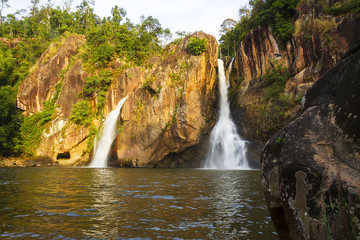 Fototapeta na wymiar Waterfall and stone beautiful with sunshine