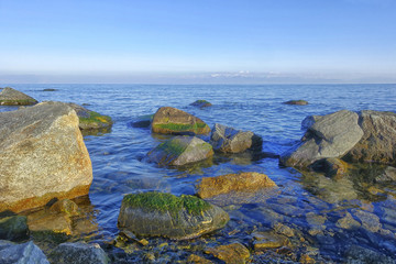 rocky shore of the lake in summer