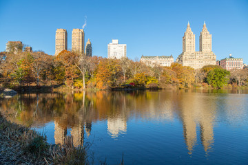 Fototapeta na wymiar New York City Buildings Reflected in The Lake in Central Park in Autumn