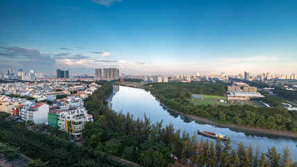 HO CHI MINH, VIETNAM - NOV 20, 2017: Royalty high quality stock image aerial view of Ho Chi Minh city, Vietnam. Beauty skyscrapers along river light smooth down urban development in Ho Chi Minh City