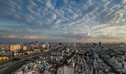 Obraz premium HO CHI MINH, VIETNAM - NOV 20, 2017: Royalty high quality stock image aerial view of Ho Chi Minh city, Vietnam. Beauty skyscrapers along river light smooth down urban development in Ho Chi Minh City