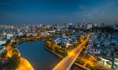 Fototapeta na wymiar HO CHI MINH, VIETNAM - NOV 20, 2017: Royalty high quality stock image aerial view of Ho Chi Minh city, Vietnam. Beauty skyscrapers along river light smooth down urban development in Ho Chi Minh City