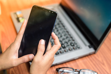 Using mobile While working on the computer.