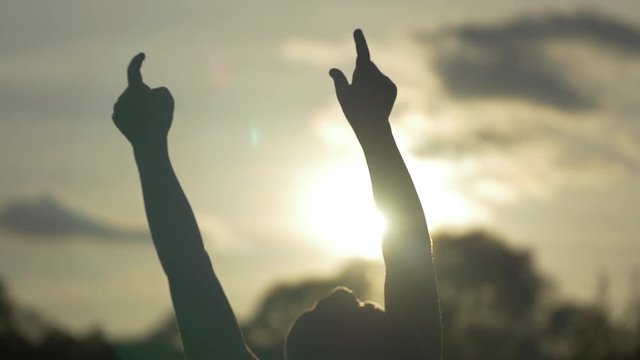 A child with hands in the air
