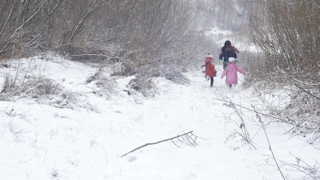 Children running in the snow