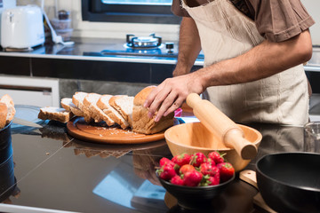 The chef is making bread in kitchen
