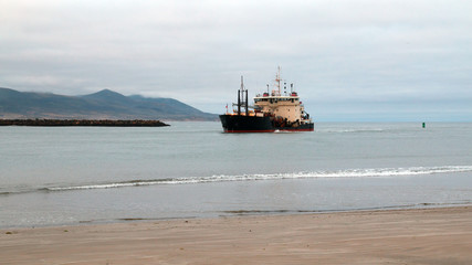 Dredging ship in Morro Bay harbor on the central coast of California United States