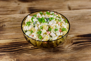 Salad with crab sticks, sweet corn, cucumber, eggs, rice and mayonnaise
