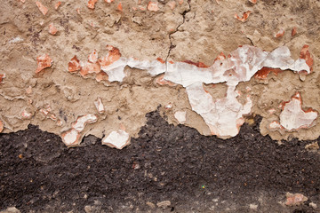 Texture of a wall with peeling plaster