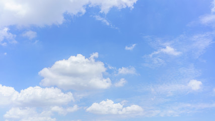 Naklejka na ściany i meble Beautiful white clouds and blue sky background