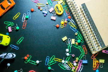 Education concept. Top view of colorful equipment on black background with copy space for text.