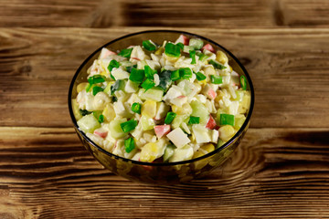 Salad with crab sticks, sweet corn, cucumber, eggs, rice and mayonnaise