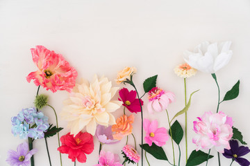 Crepe paper flowers on white wooden background - 195432630