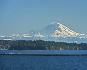 Interstate 90 Floating Bridge cuts across Lake Washington near Seattle on a Perfectly Blue Day with Mount Rainier in the Distance