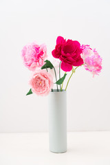 Crepe paper flower bouquet with peonies in a vase