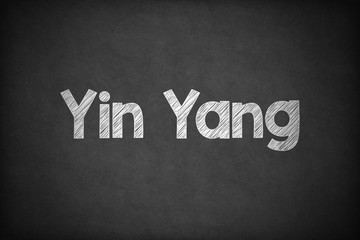 Yin Yang on Textured Blackboard.