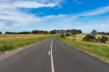 Picturesque countryside road on sunny day