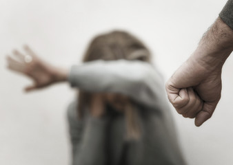 Man beating up his wife illustrating domestic violence