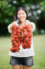 Girl Holding Organic Rambutan Fruits in Tahiti French Polynesia Film Photo