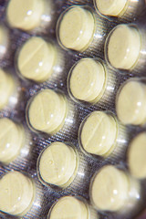 Photo of Yellow pills in a blister pack