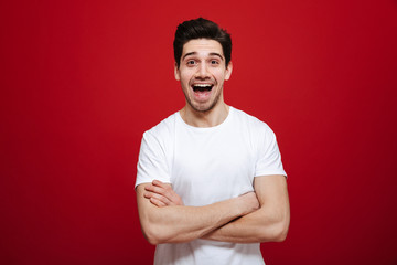 Portrait of an excited young man in white t-shirt