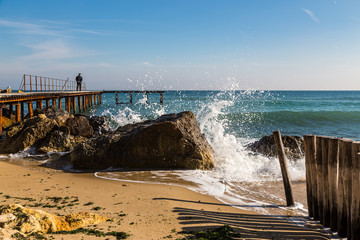 A man on an empty pier.