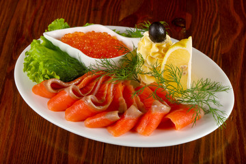 Sliced trout and red caviar