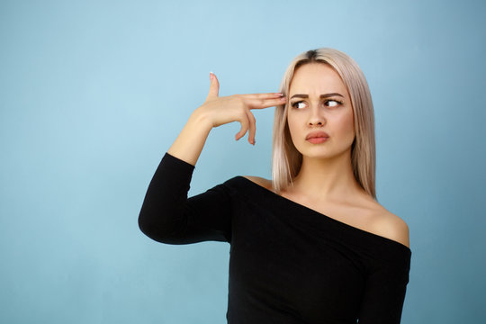 Teenage Woman Committing Suicide With Finger Gun Gesture