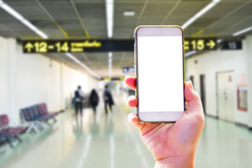 People hand use cellphone at the hall airport background with copy space on screen for using mobile app about activities in the airport or checking flight plan