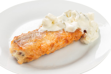 fried fish with pineapple and white sauce on a plate, white background