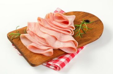 thin slices of ham and rosemary